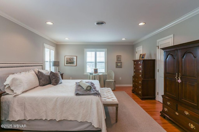 2528 N Hills Dr, Williamsport, PA 17701 - bedroom with crown molding, visible vents, recessed lighting, and light wood-style floors