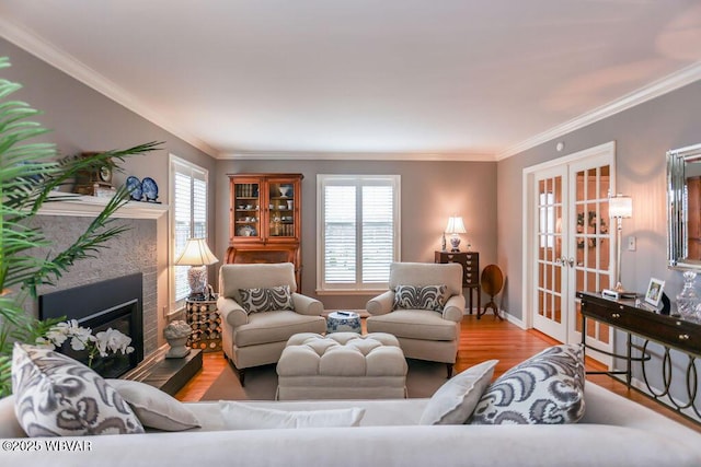 2528 N Hills Dr, Williamsport, PA 17701 - living area featuring a glass covered fireplace, french doors, ornamental molding, and wood finished floors