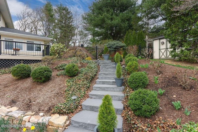 2528 N Hills Dr, Williamsport, PA 17701 - view of yard featuring a deck, a storage shed, fence, an outdoor structure, and stairs