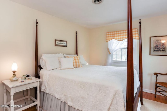 2528 N Hills Dr, Williamsport, PA 17701 - bedroom featuring wood finished floors, baseboards, and visible vents