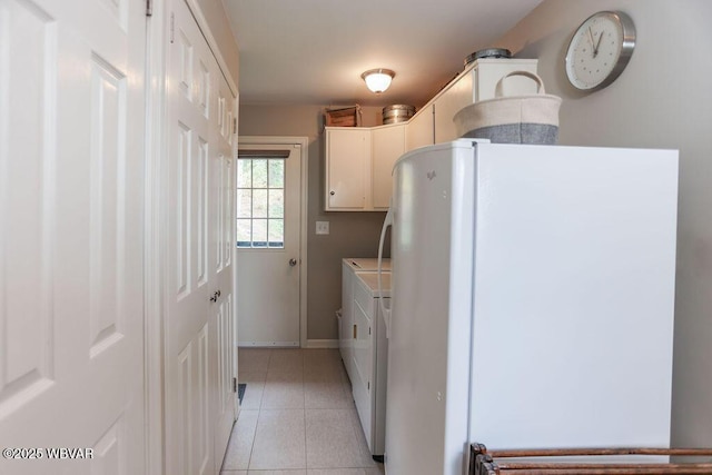 2528 N Hills Dr, Williamsport, PA 17701 - laundry area featuring washer and dryer, light tile patterned flooring, baseboards, and cabinet space