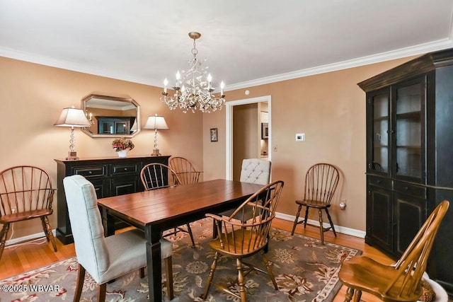 2528 N Hills Dr, Williamsport, PA 17701 - dining space with light wood-type flooring, baseboards, an inviting chandelier, and ornamental molding