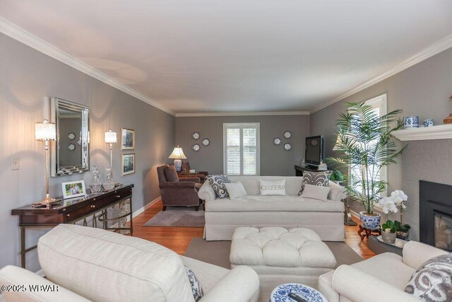 2528 N Hills Dr, Williamsport, PA 17701 - living room featuring crown molding, wood finished floors, and a glass covered fireplace