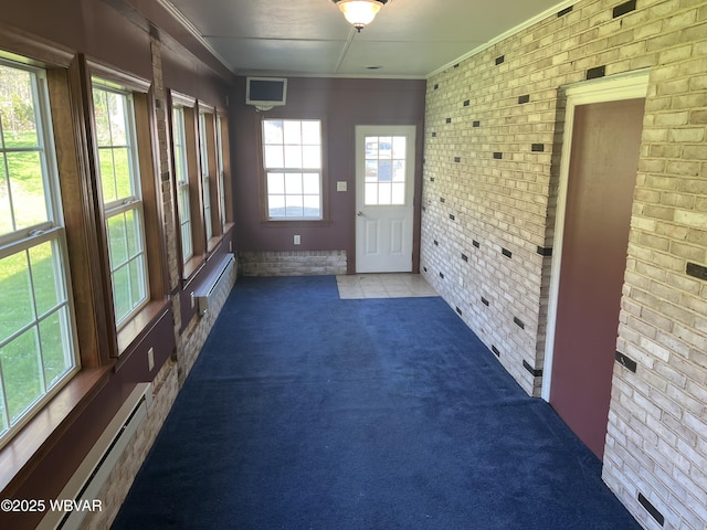 unfurnished sunroom featuring a baseboard heating unit and baseboard heating