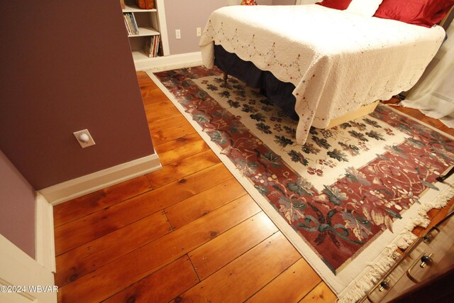 bedroom featuring wood-type flooring