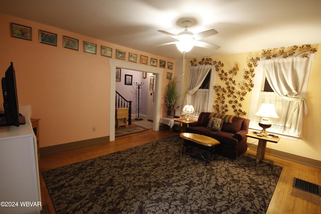 sitting room featuring ceiling fan and wood-type flooring