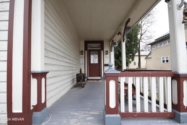 doorway to property featuring a porch