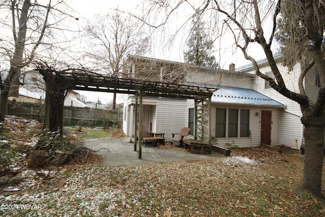 rear view of house with a patio area and a pergola