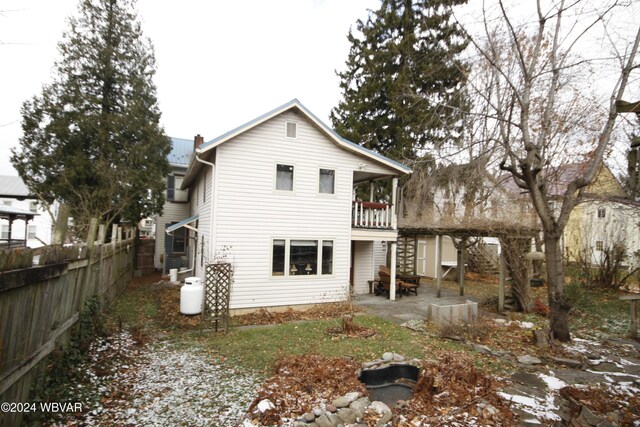 rear view of house with a balcony