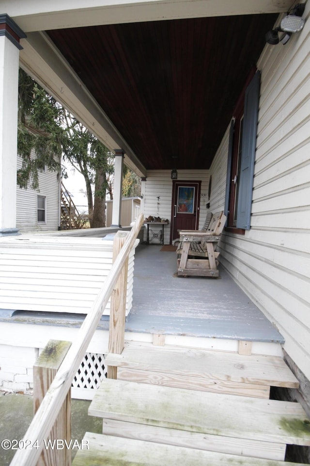 wooden terrace featuring a porch