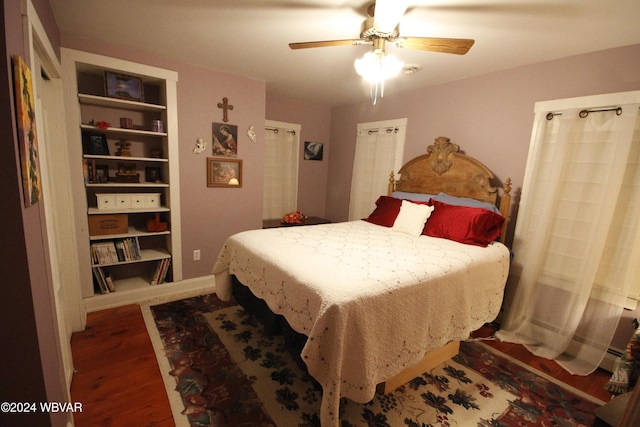 bedroom featuring ceiling fan and dark wood-type flooring