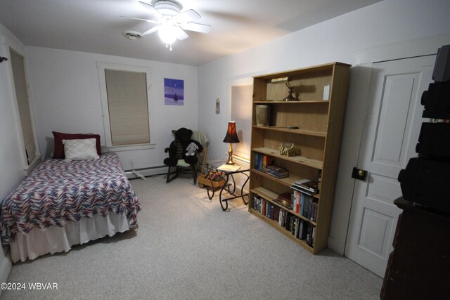 carpeted bedroom featuring ceiling fan and a baseboard radiator