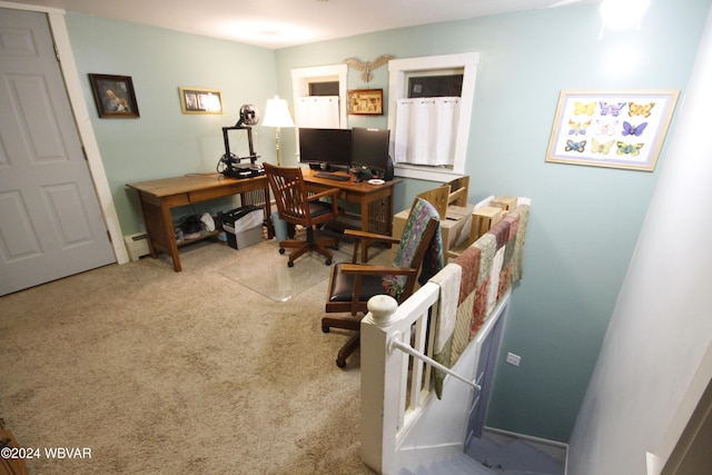 carpeted office with a baseboard heating unit