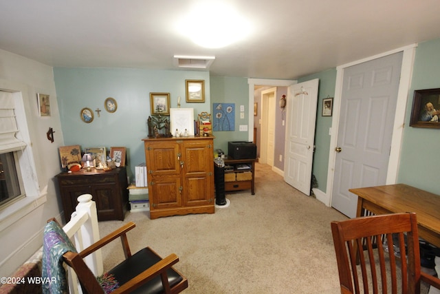 sitting room with light colored carpet