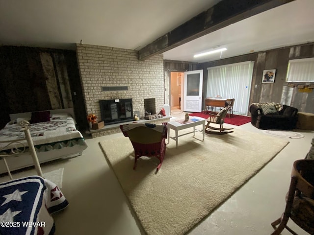 10296 Renovo Rd, North Bend, PA 17760 - living room with concrete flooring, beamed ceiling, and a fireplace