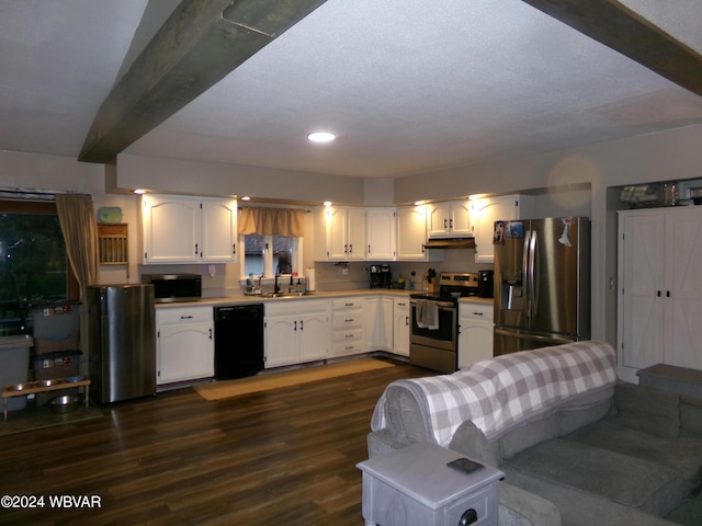 kitchen with sink, dark hardwood / wood-style floors, appliances with stainless steel finishes, beam ceiling, and white cabinetry