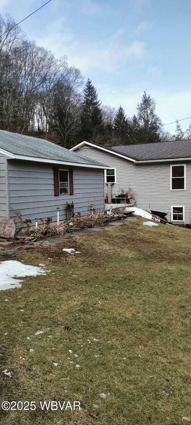 rear view of house with a lawn