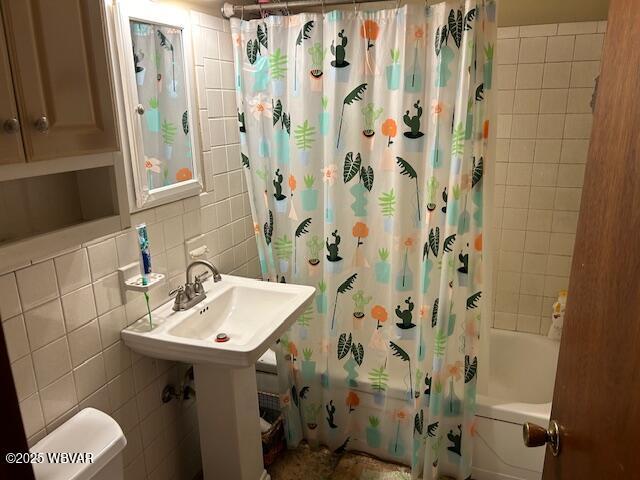 5477 Bloomingrove Rd, Cogan Station, PA 17728 - full bath featuring tile walls, toilet, tasteful backsplash, and shower / bathtub combination with curtain