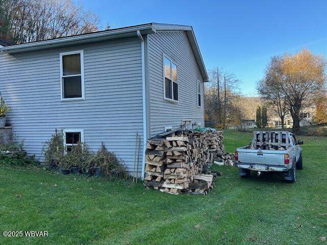 5477 Bloomingrove Rd, Cogan Station, PA 17728 - view of property exterior featuring a lawn