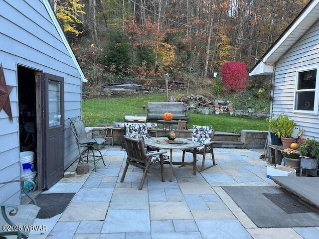 5477 Bloomingrove Rd, Cogan Station, PA 17728 - view of patio with a forest view