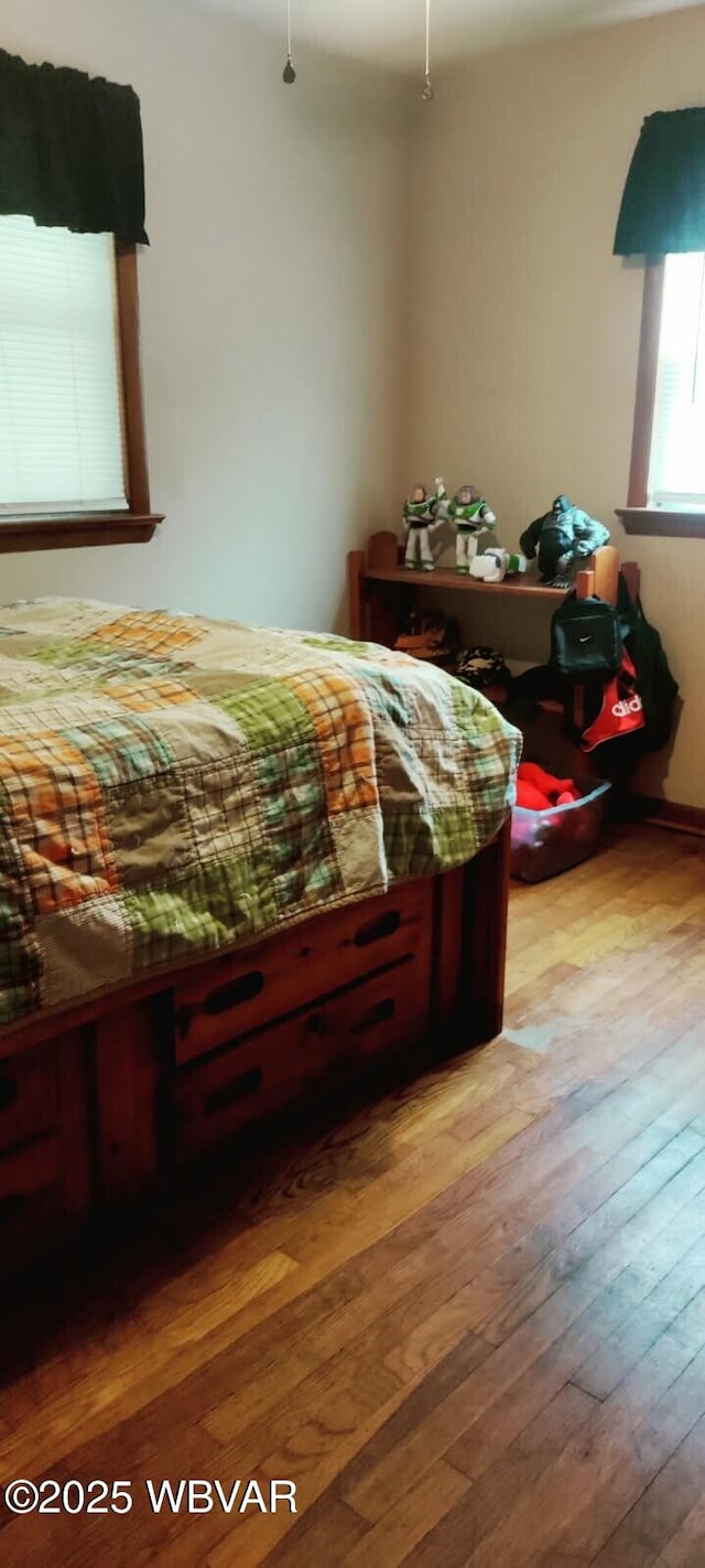 bedroom with light wood-style floors