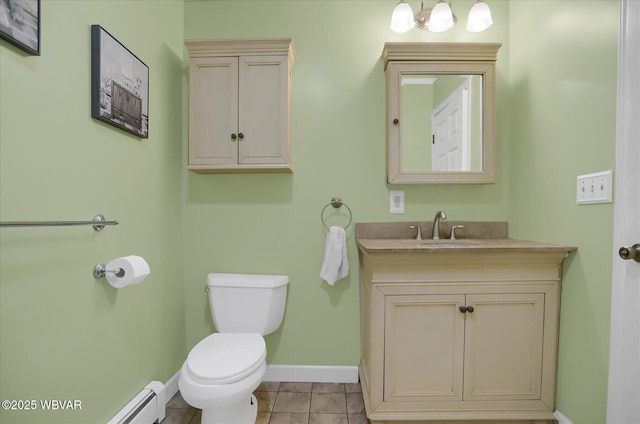 bathroom with a baseboard radiator, toilet, tile patterned floors, and vanity