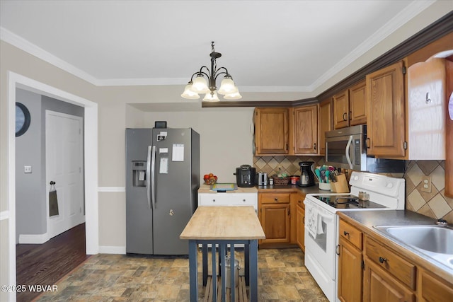 kitchen featuring sink, stainless steel appliances, crown molding, and backsplash