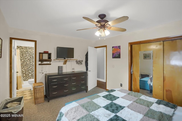 bedroom featuring a closet, ceiling fan, and ensuite bath