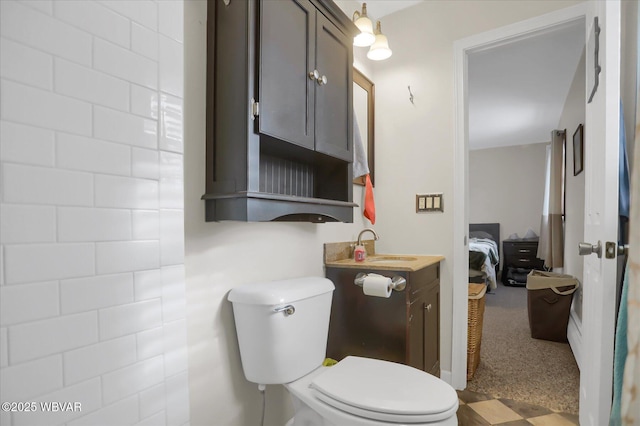 bathroom with toilet and vanity