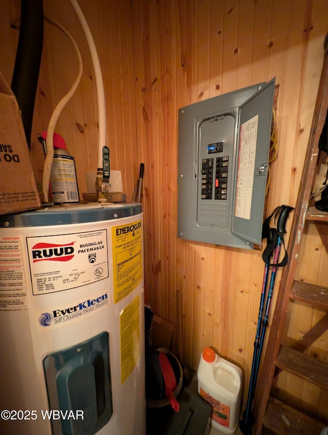 utility room featuring water heater and electric panel