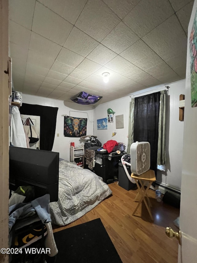 bedroom featuring hardwood / wood-style flooring