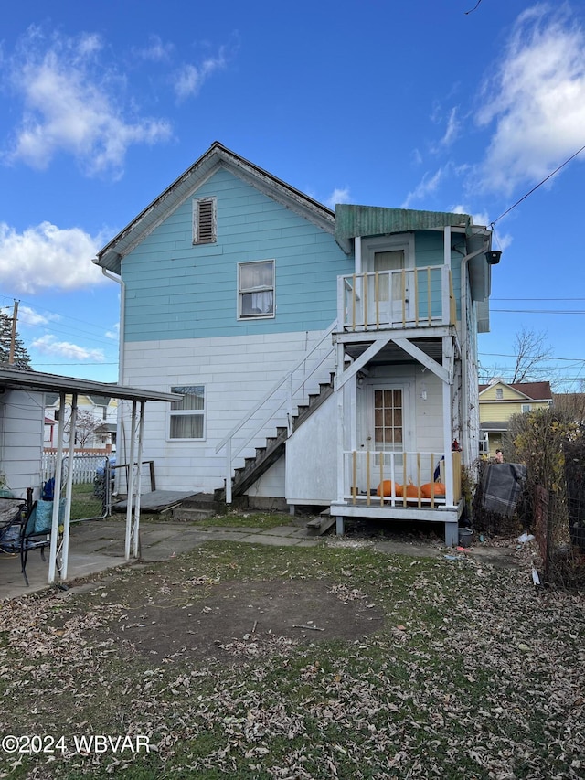 rear view of house with a balcony