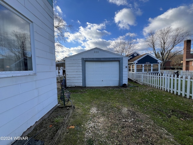 garage featuring a yard