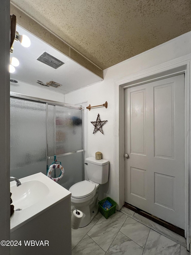 bathroom with vanity, toilet, and walk in shower