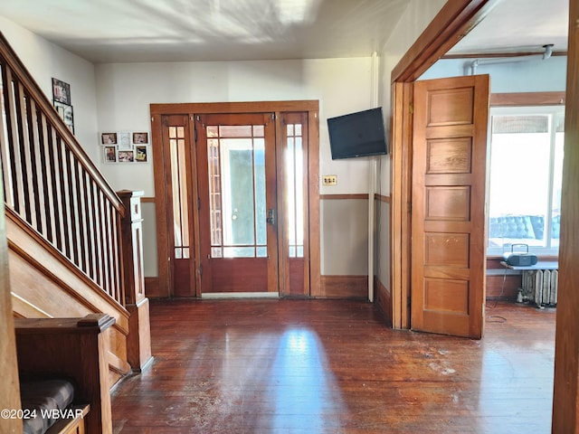 entryway featuring radiator heating unit and dark hardwood / wood-style flooring