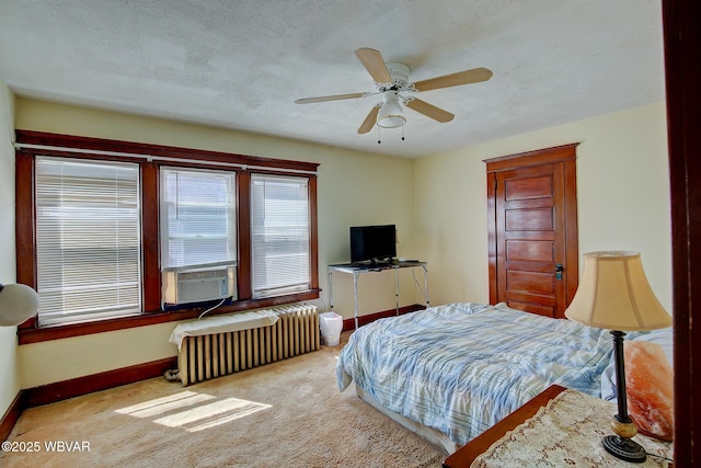 104 Pearl St, Lock Haven, PA 17745 - carpeted bedroom with radiator, cooling unit, baseboards, a textured ceiling, and ceiling fan