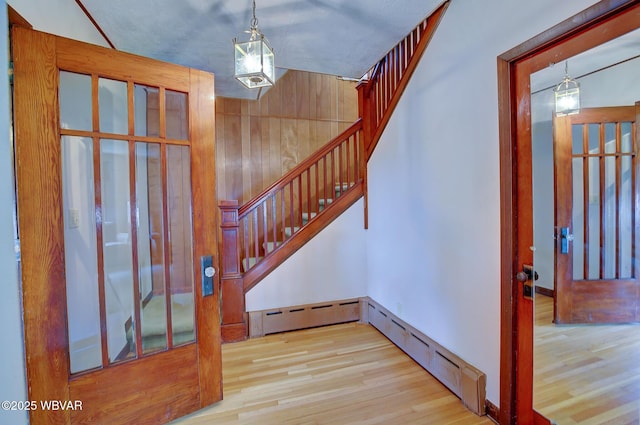 104 Pearl St, Lock Haven, PA 17745 - entryway with wood finished floors, stairway, and baseboard heating