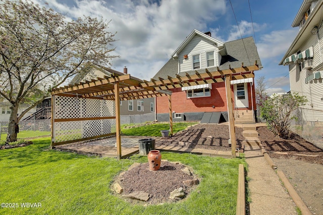 104 Pearl St, Lock Haven, PA 17745 - rear view of house with a pergola, brick siding, a patio, a chimney, and roof with shingles