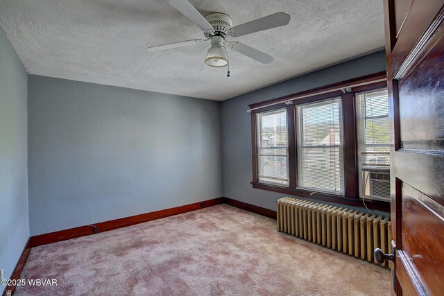 104 Pearl St, Lock Haven, PA 17745 - unfurnished room with radiator heating unit, carpet flooring, baseboards, a textured ceiling, and ceiling fan