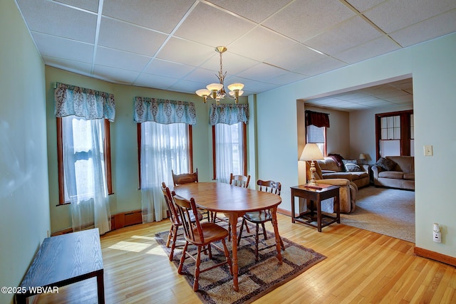 104 Pearl St, Lock Haven, PA 17745 - dining area featuring a drop ceiling, a chandelier, and light wood-style floors