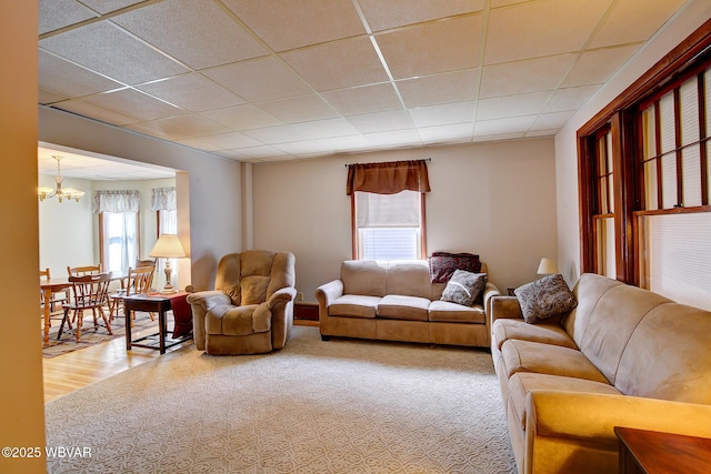 104 Pearl St, Lock Haven, PA 17745 - living room featuring plenty of natural light, a chandelier, and a paneled ceiling