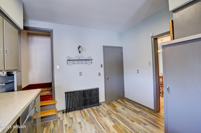 104 Pearl St, Lock Haven, PA 17745 - unfurnished dining area with radiator and light wood-style floors