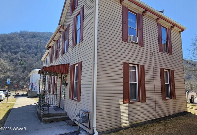 view of side of property featuring cooling unit