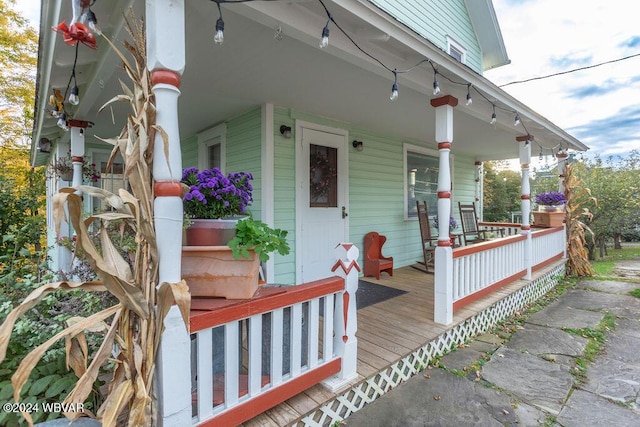 view of exterior entry with covered porch