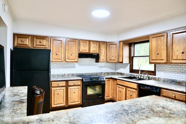 kitchen with sink, tasteful backsplash, and black appliances