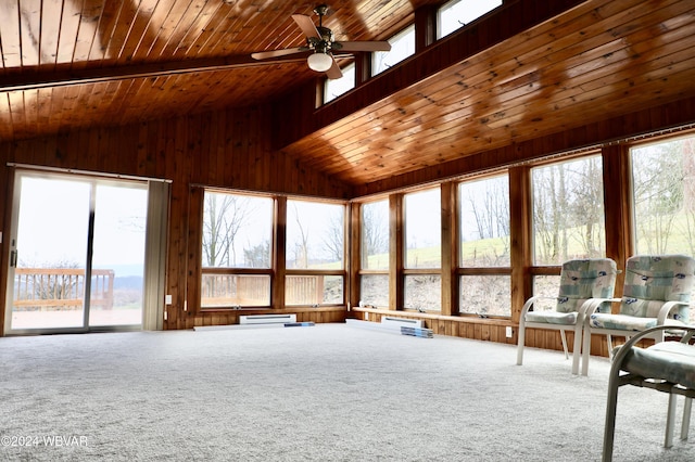 unfurnished sunroom with ceiling fan, baseboard heating, and vaulted ceiling