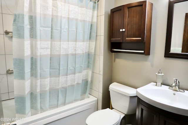 full bathroom featuring vanity, toilet, and shower / bathtub combination with curtain