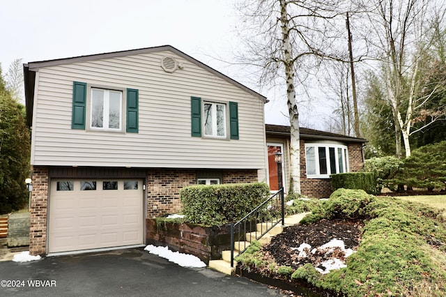 split level home with a garage