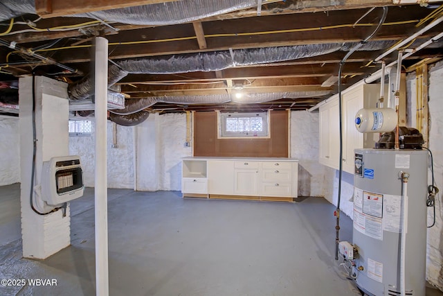 basement featuring water heater and heating unit
