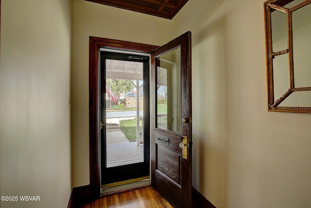 doorway with wood finished floors